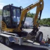 Caterpillar 301.7D + 3 Löffel + Anhänger 2017